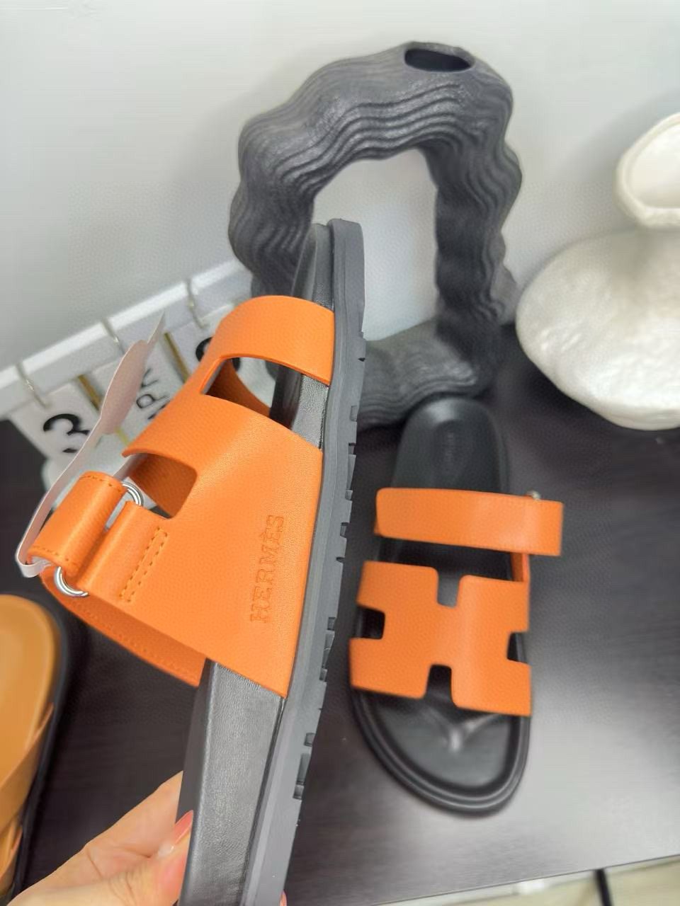 Hermès Orange Interwoven Slide Sandals — side