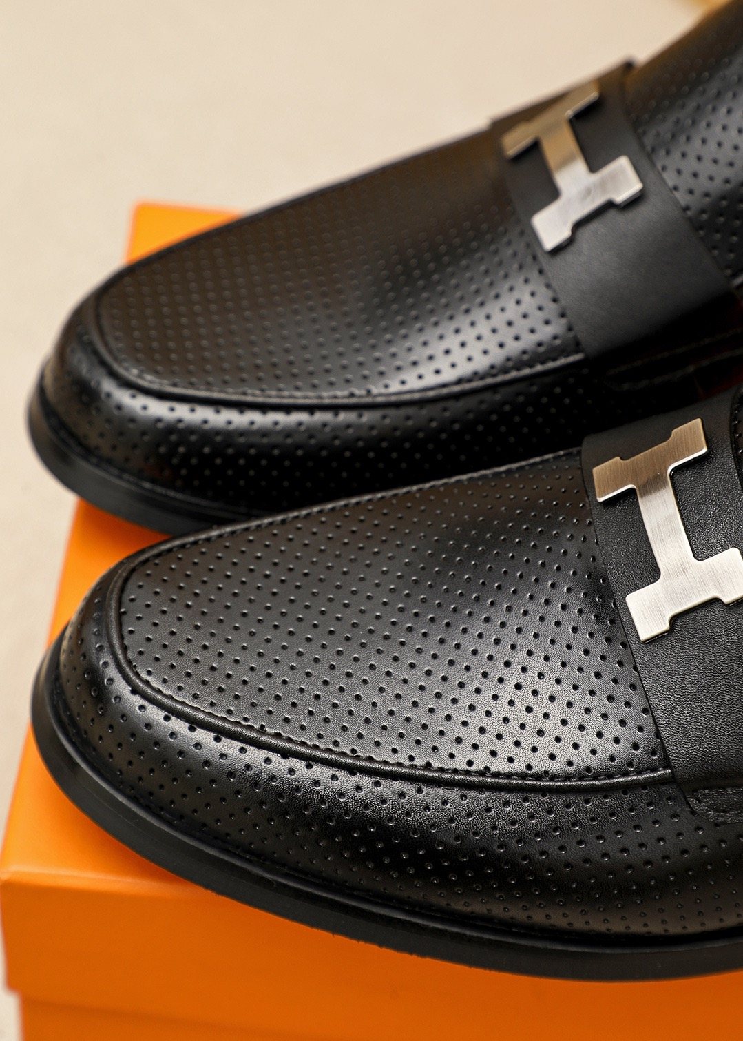 Hermès Black Perforated H-Hardware Loafers — detail
