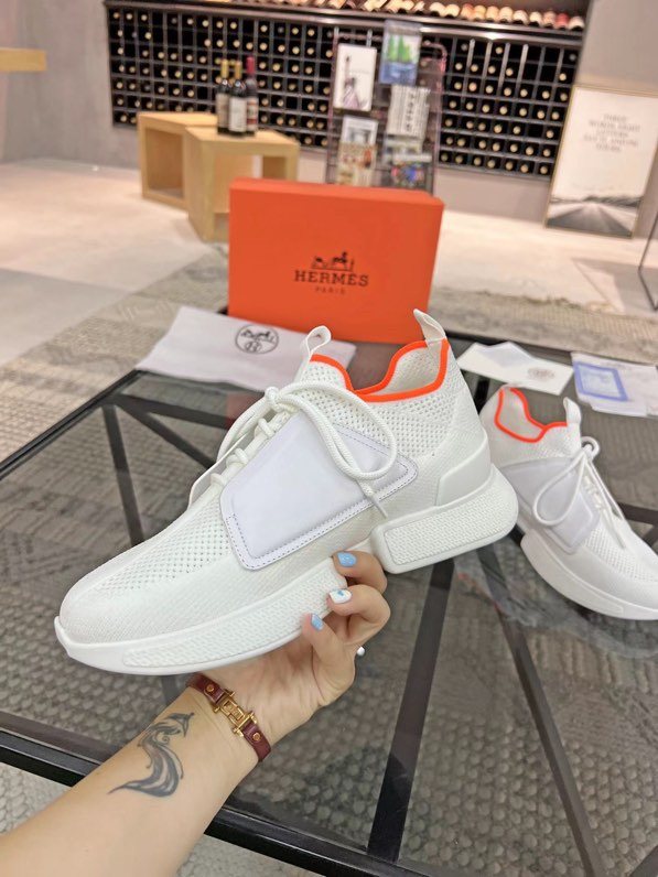 Hermès White Orange Knit Sneakers — model