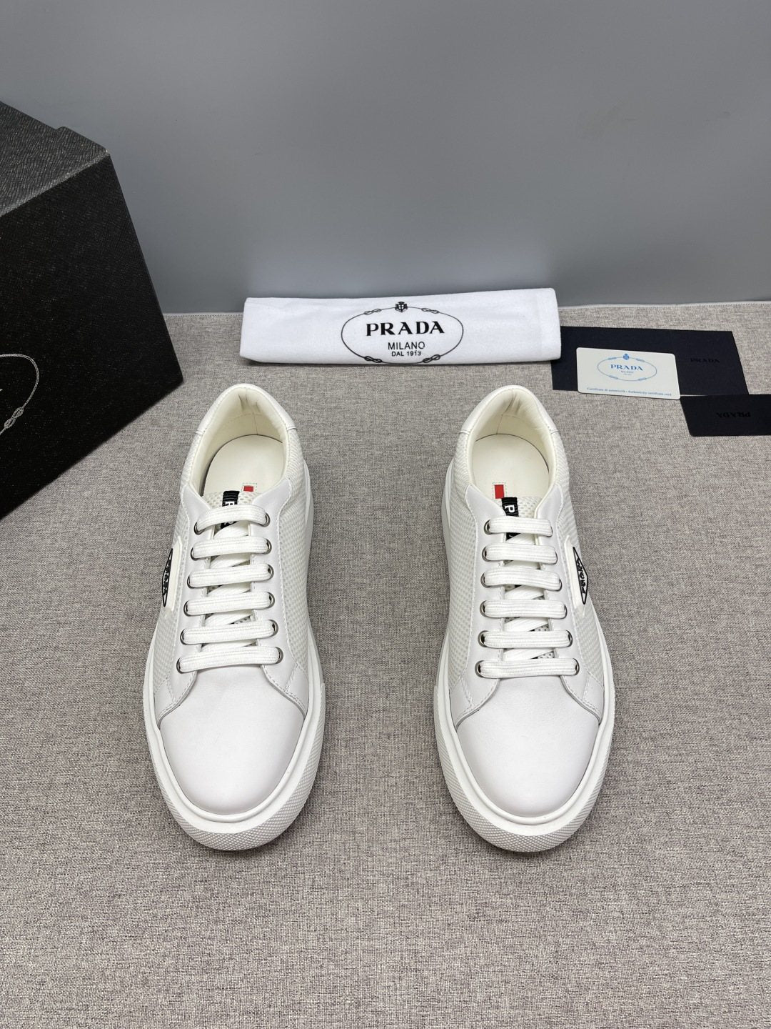 Prada Triangle Patch Low-Top Sneakers — front