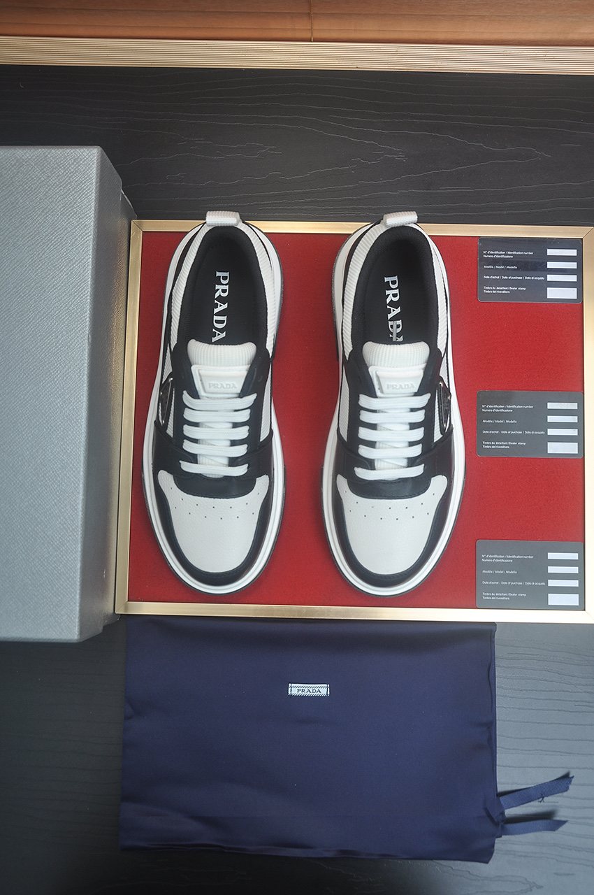 Prada Triangle Plaque Low-Top Sneakers — front