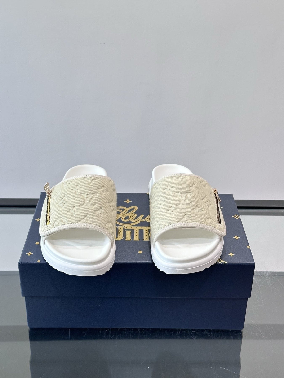 Louis Vuitton Embossed Monogram Slide Sandals — front