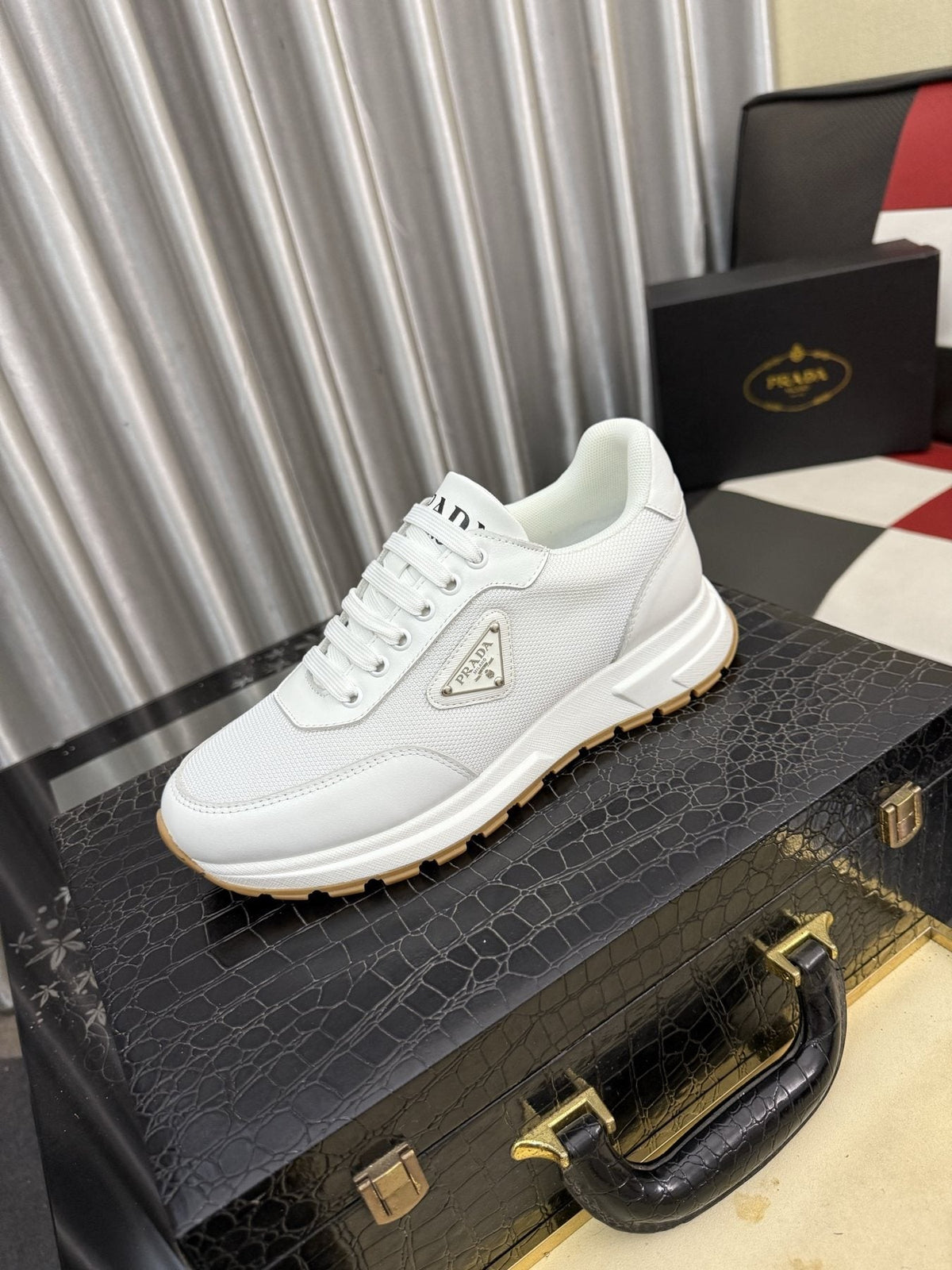 Prada Triangle Plaque Low-Top Sneakers — front