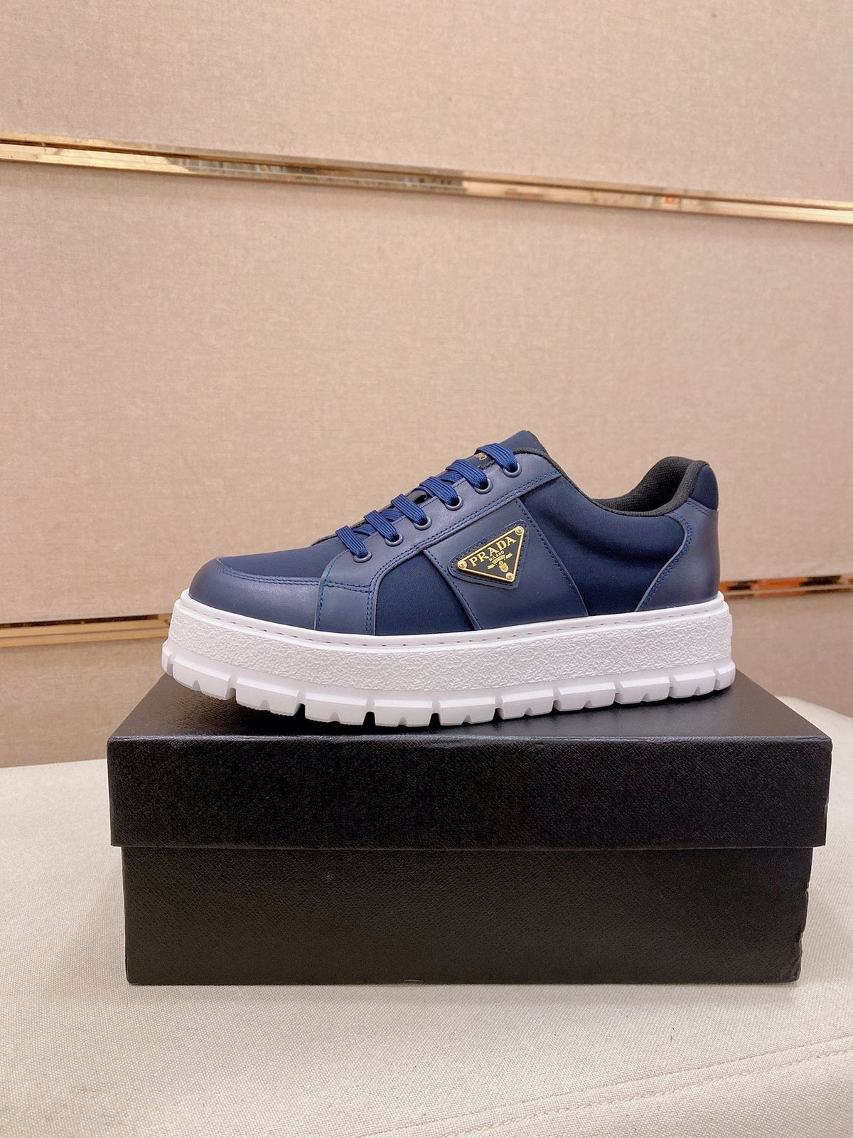 Prada Triangle Plaque Low-Top Sneakers — front