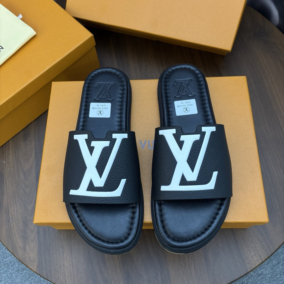 Louis Vuitton Raised-Monogram Slide Sandals — front
