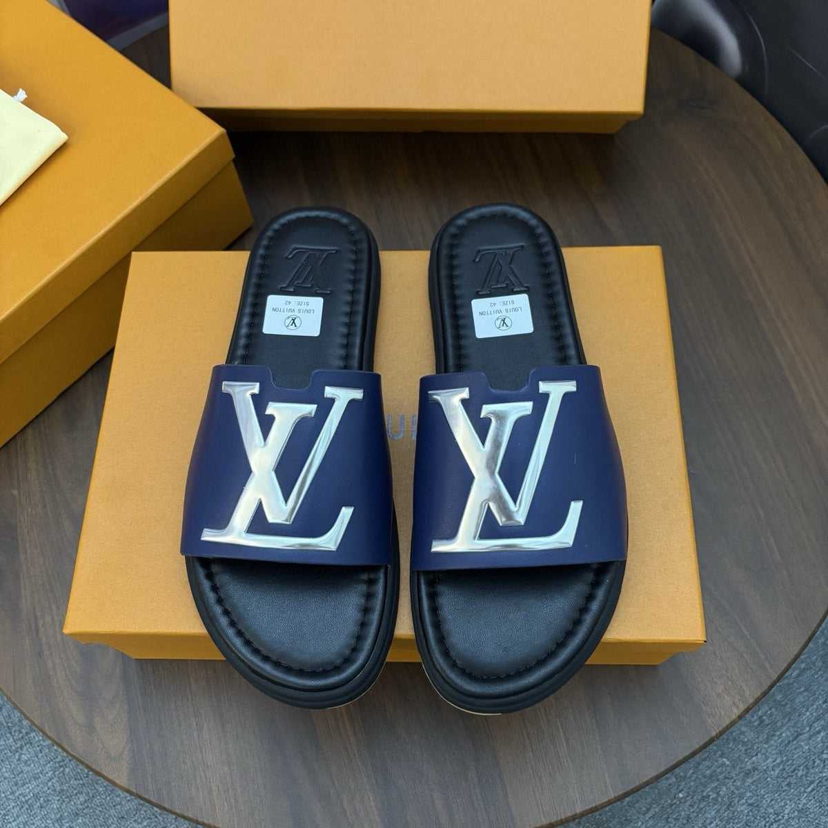 Louis Vuitton Raised-Monogram Slide Sandals — front