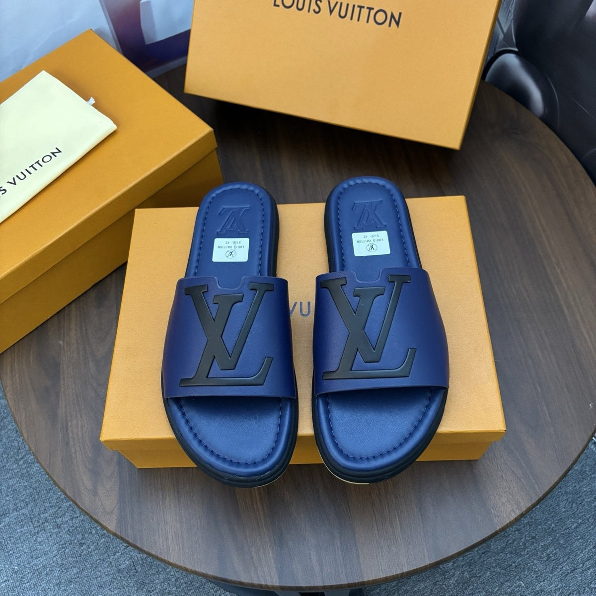 Louis Vuitton Raised-Monogram Slide Sandals — hero
