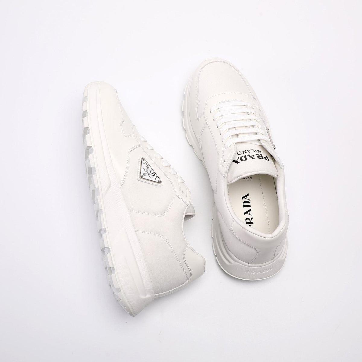 Prada Triangle Plaque Low-Top Sneakers — front