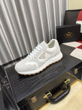 Prada Triangle Badge Low-Top Sneakers — hero