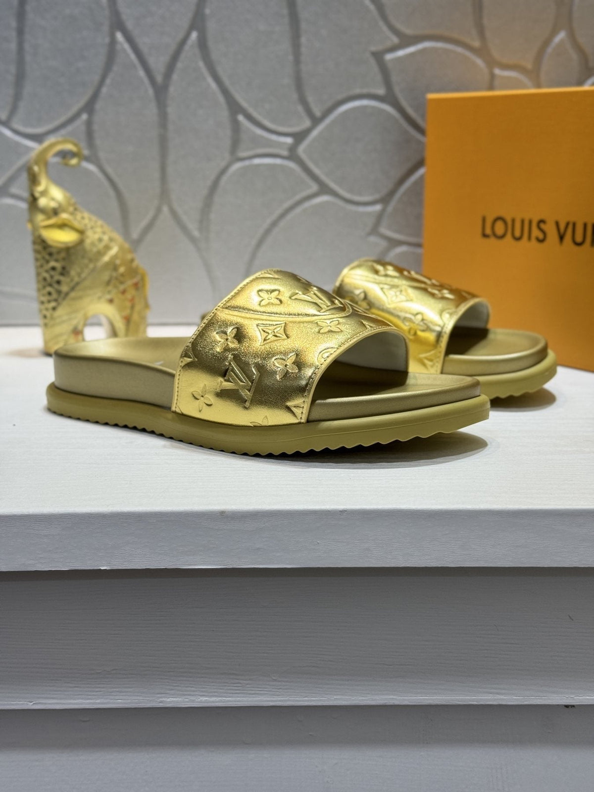 Louis Vuitton Embossed Slide Sandals — front